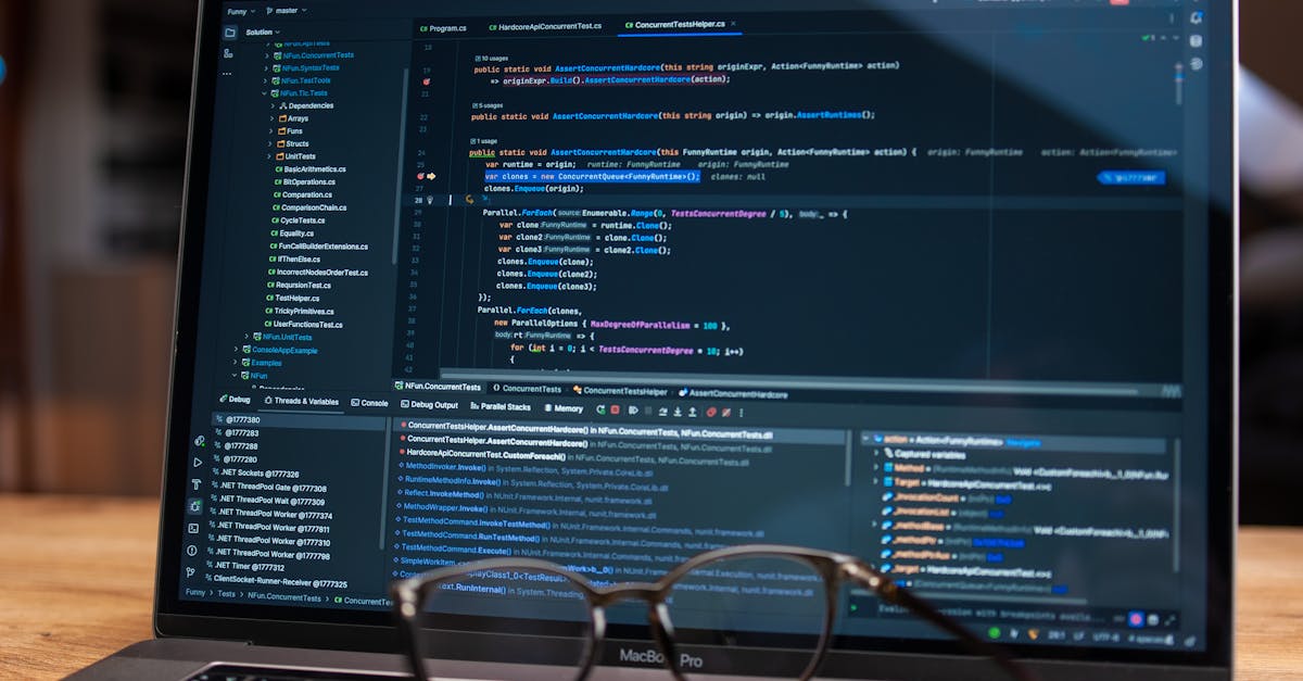 Laptop screen showing debugging software with code, perfect for tech and software development themes.